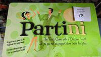 Green box with Partini logo and dancing couple illustration