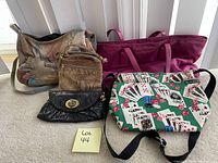 Photo showing four assorted purses: tan and brown shoulder bag, maroon tote, black clutch, and white purse with playing cards pattern.