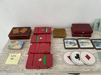 Playing cards and various game-related decor items displayed together on a white surface.