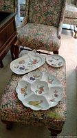 Photo showing three Royal Worcester Evesham serving dishes on floral patterned ottoman: a large divided dish, a rectangular platter, and a small round dish.