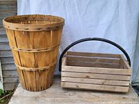 Photo showing both the tapered basket and the wooden berry carrier side by side against a white backdrop.