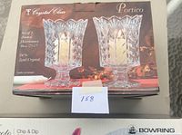 Box of set of 2 footed hurricanes by Portico, 24% lead crystal, box slightly worn.