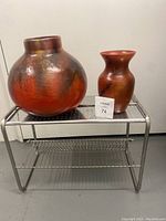 Full view of the baker's cooling rack with the two ceramic vases placed on top.