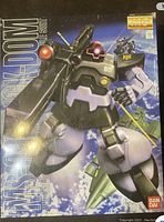 Front cover of the box showing completed Rick-Dom model with weapons and background space scene