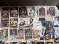 Photo showing a mix of football, basketball, and baseball cards, focused on Joe Montana and Michael Jordan cards.
