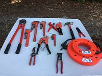 Full layout of all tools on white table with natural outdoor background