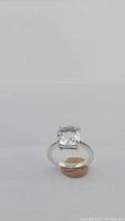 Front view of ring showing cushion-cut crystal quartz atop braided-style band