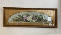 Framed large floral painting with white roses and purple flowers, showing full piece and frame.