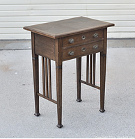 Full view of the antique German oak sewing/hallway table showing overall design and structure.