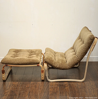 Chair and ottoman side by side showing overall shape of both pieces
