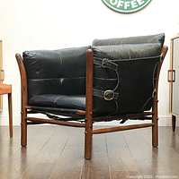 Three-quarter view showing overall form, frame and cushions