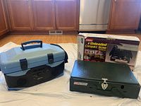 Overall view of the Coleman stove with box and GPX radio cooler together on floor.