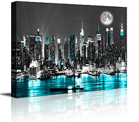 Front view of canvas wall art showing New York skyline at night with blue illuminated water and buildings.