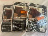 Three sealed packs of Better Trends Chenille Tufted Bedspreads showing packaging with product details.