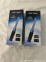 Three boxed Dust Daddy cleaning tools, new in packaging with product image showing flexible dusting bristles.