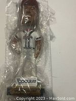 Full bobblehead figure of Ron Gant in Atlanta Braves uniform with packaging plastic visible.