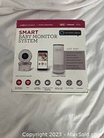 Full box view of Project Nursery Smart Baby Monitor System including smart baby monitor camera, smartphone app interface, and Alexa speaker.