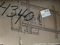 Box of Sanus full-motion TV mount showing illustration of the mount on the box with mounting arms and brackets.