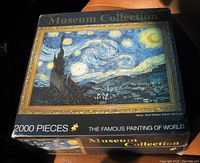 Photo showing the front top of the sealed box featuring Van Gogh's Starry Night image with 'Museum Collection' text and 2000 pieces label.