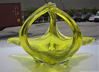 Front view of the vibrant yellow three-handled art glass bowl showing its chalet style and organic flowing form.