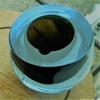 Top-down and angled views of the tri-colour glass bowl showing the opening and color layering.