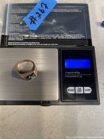 Ring on digital scale showing 7.0g weight