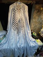 Full view of the Nigerian traditional top hanging, showing overall length and fit.