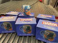 Six boxed Captain America character molded mugs with one mug on display showing head design