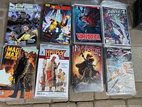 Photo of 8 comic books with variant covers from Comic Bloc including Star Trek, Judge Dredd, Vampirella, Silver Surfer, Mad Max Fury Road, Hellboy and the B.P.R.D., Red Sonja, and Pacific Rim.