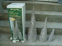 Photo showing box and the three glitter Christmas tree decorations measuring 24", 18", and 12" respectively.