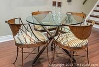 Dining room set with 4 iron chairs and round glass top table
