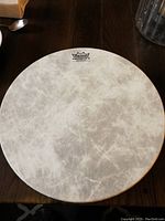 Top view of the Remo Fiberskyn 3 drumhead showing white textured synthetic surface and drum diameter.