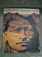 Cover photo showing front of hardcover book with dust jacket featuring an illustrated Native American face on rocky desert background.