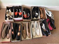 Top view of all shoes in boxes showing various colors and styles.