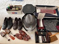 Full lot overview showing shoes, shoe care items, hat, ties, cummerbunds, and small accessories