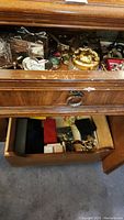 Top drawer with assorted costume jewelry and trinket boxes