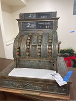 Front view of entire cash register showing body, keys, drawer