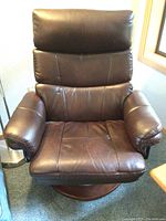 Front view of chocolate brown leather Stressless swivel recliner chair