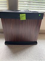 Full front view of Kenmore Quiet Humidifier showing wood veneer panel and black top section with power cord.