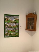 Yorkshire Abbeys and Castles fabric wall hanging and wood corner display cabinet mounted on wall
