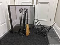 Full lot view showing fire screen, tool set on stand, and log holder