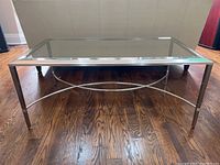 Front view showing overall shape and design of the glass top with chrome frame.