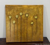 Full view of the square canvas with seven yellow flowers against a textured golden background.