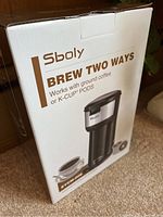 Photo of the Sboly coffee machine box showing brand and brewing compatibility.