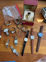 Lot of 11 assorted wristwatches with various dial styles and bands including leather and metal. Some watches show wear and age.