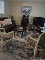 Photo of a room featuring a Realistic audio component set and furniture in the background.