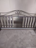 Full front view of the metal king size headboard showing the complete design and condition.