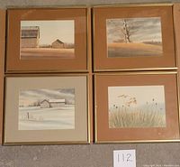 Four framed prints by James Bessey showing rural and nature scenes, arranged in a 2x2 grid on the floor.