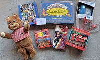 Complete lot including boardgame, puzzles, vintage teddy bear, toy phone, valentines, and headpiece