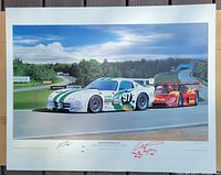 Front view of the signed Mosport 500 poster showing cars #97 and 710 on the track with signatures visible at the bottom.